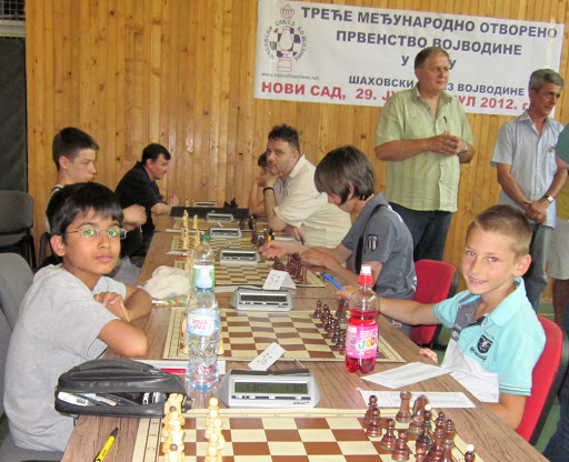 Chess Tournament Begins.  Round 1 - Akshat Chandra and the merry Grcic Vukasin. I give the cameraman, the 