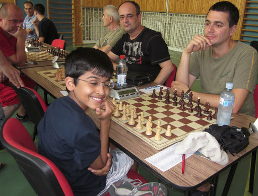 Waiting and smiling while I can.  Akshat Chandra and Vladimir Klasan waiting to begin Chess Round 3