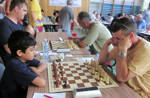 Akshat Chandra and Nenad Dimitrijevic in Chess Round 6. You can see Andrew Stone from England next to me. Andrew is a teacher and a strong chess player who had braved the Serbian Summer to play here.