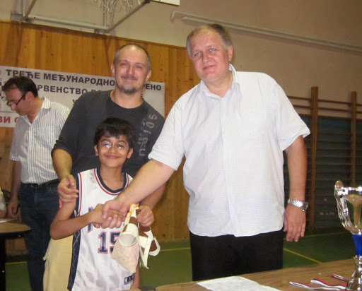 Akshat Chandra with Chief Organizer GM Sinisa Drazic (behind me), receiving the Chess Tournament Prize for U16