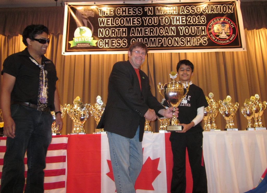 Being handed the trophy by the Canadian Chess Federation executive